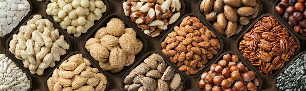 seeds and nuts background, natural food in wooden bowls, top view.
